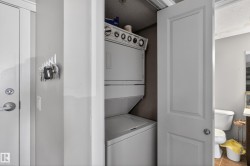 Stackable washer and dryer unit within a dedicated laundry alcove - 