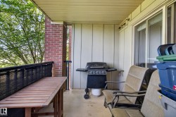 Covered patio featuring concrete flooring and a sliding glass door - 