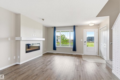 2241 Price Lane, Edmonton, AB - Indoor Photo Showing Living Room With Fireplace