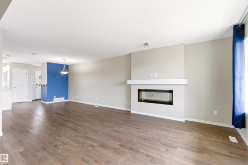 2241 Price Lane, Edmonton, AB - Indoor Photo Showing Living Room With Fireplace