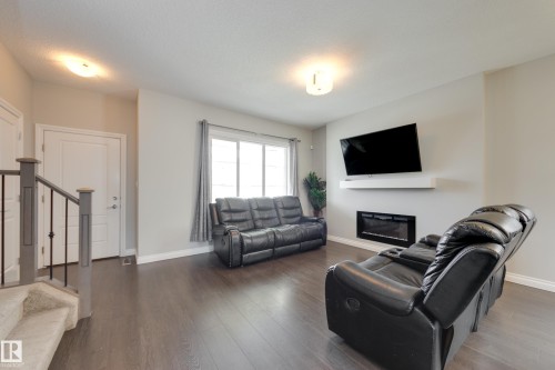 6687 Cardinal Road, Edmonton, AB - Indoor Photo Showing Living Room With Fireplace