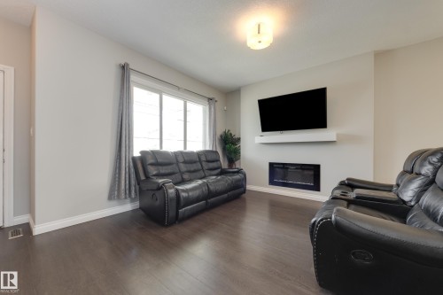 6687 Cardinal Road, Edmonton, AB - Indoor Photo Showing Living Room With Fireplace
