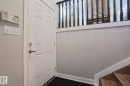 Six-panel entry door with brushed nickel hardware - 313 Jillings Crescent, Edmonton, AB  - Indoor Photo Showing Other Room 