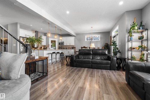 Open-concept living area with wood-finish flooring - 524 Mcdonough Way, Edmonton, AB - Indoor Photo Showing Living Room