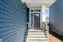 Entryway featuring a dark gray door with square glass pane, sidelight, and transom window - 524 Mcdonough Way, Edmonton, AB  - Outdoor 