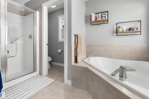 Built-in soaking tub with deck-mounted chrome fixtures - 524 Mcdonough Way, Edmonton, AB - Indoor Photo Showing Bathroom