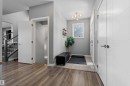 Inviting entryway featuring wood-finish flooring transitioning to tile - 524 Mcdonough Way, Edmonton, AB  - Indoor Photo Showing Other Room 