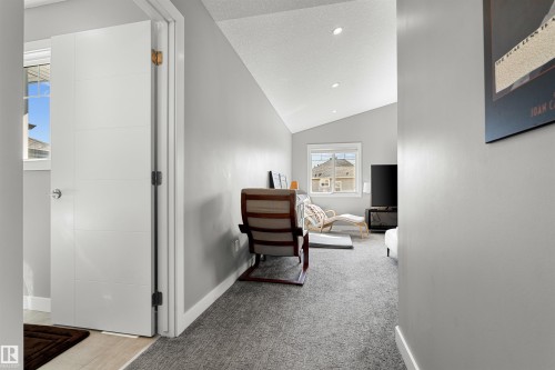 Carpeted room with a vaulted ceiling and recessed lighting - 524 Mcdonough Way, Edmonton, AB - Indoor Photo Showing Other Room