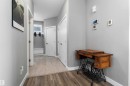 Hallway featuring wood-finish flooring transitioning to tile - 524 Mcdonough Way, Edmonton, AB  - Indoor Photo Showing Other Room 