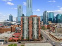 High-rise residential building with a two-tone facade and multiple balconies, situated within an urban setting - 905 10303 105 Street Nw, Edmonton, AB  - Outdoor With Facade 