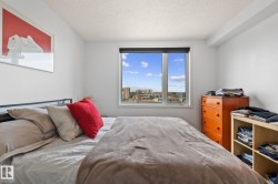 Bright room featuring a large window with urban scenery - 