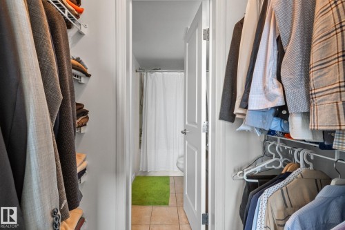 Walk-in closet with white wire shelving and hanging rods - 905 10303 105 Street Nw, Edmonton, AB - Indoor With Storage
