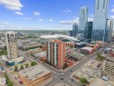 Expansive urban skyline featuring contemporary high-rise buildings and a modern stadium structure - 905 10303 105 Street Nw, Edmonton, AB  - Outdoor With View 