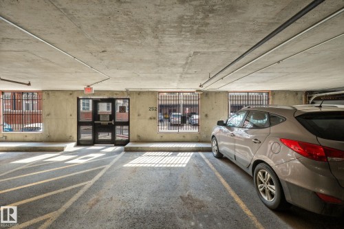 Dedicated parking space within a concrete structure - 905 10303 105 Street Nw, Edmonton, AB - Indoor Photo Showing Garage