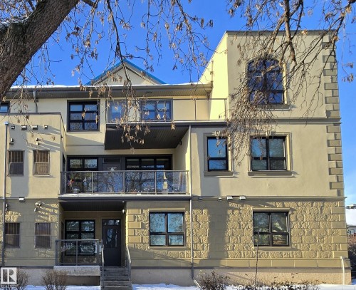 Multi-story stucco exterior with decorative stone accents - 108 9603 98 Avenue Nw, Edmonton, AB - Outdoor With Facade