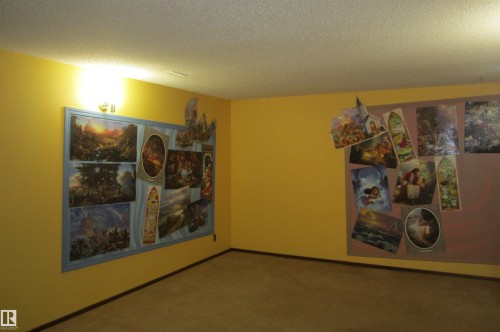 Carpeted room with yellow painted walls - 3814 37 Avenue, Leduc, AB - Indoor Photo Showing Other Room