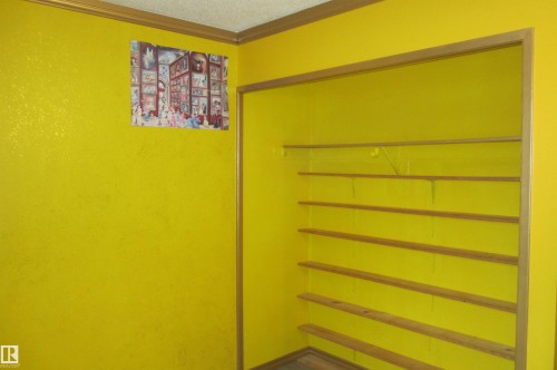 Recessed wall shelving with wood-finish shelves - 3814 37 Avenue, Leduc, AB - 
