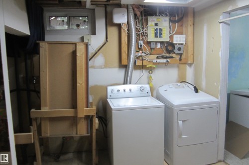 Laundry area with utility hookups and electrical panel - 3814 37 Avenue, Leduc, AB - Indoor Photo Showing Laundry Room
