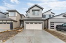 Contemporary two-story residence featuring a two-car garage, concrete driveway, and mixed siding exterior - 1972 210 Street, Edmonton, AB  - Outdoor 