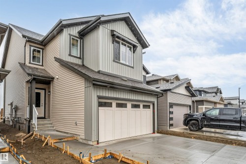 Two-story residence featuring light gray and beige siding - 1972 210 Street, Edmonton, AB - Outdoor
