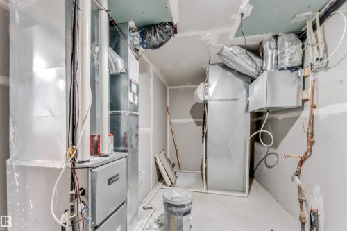 Utility room featuring unfinished drywall, exposed ductwork, and copper piping - 1972 210 Street, Edmonton, AB - Indoor
