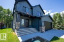Modern two-story residence featuring a blue vertical and horizontal siding exterior - 132 Heron Point Close, Rural Wetaskiwin County, AB 