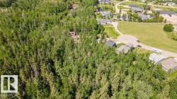 Heavily wooded lot with a single-family residence, surrounded by mature trees - 