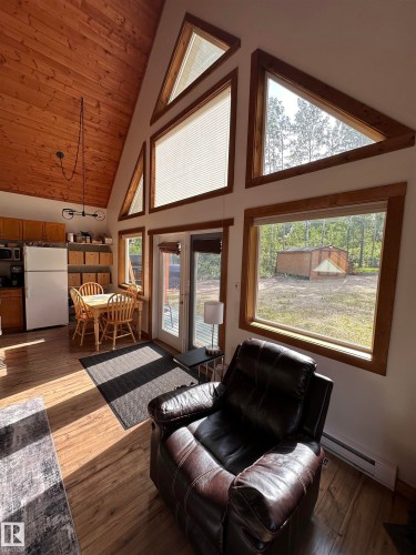 Vaulted wood-finish ceiling with a multi-paned window design - #20 59316 Rr 54, Rural Barrhead County, AB 