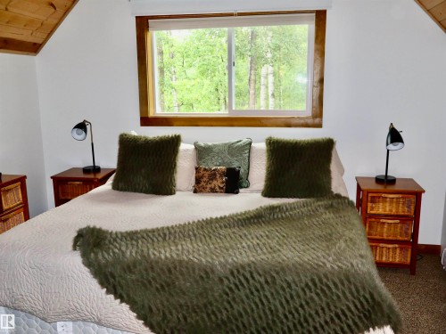Vaulted wood-paneled ceiling with a skylight-style window - #20 59316 Rr 54, Rural Barrhead County, AB 