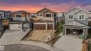 Contemporary multi-story residence featuring a two-car garage with wood-finish doors - 4015 39 Street, Beaumont, AB  - Outdoor With Facade 