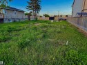 Cleared lot featuring mature perimeter fencing along one side - 11640 80 Street, Edmonton, AB 