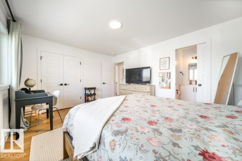 Bright room featuring wood-finish flooring and white walls - 11303 111 Avenue, Edmonton, AB - Indoor Photo Showing Bedroom