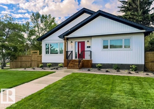 Modern single-story residence with white siding and dark trim - 11303 111 Avenue, Edmonton, AB - Outdoor