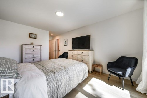 Bedroom featuring recessed lighting, light wood-finish flooring, and white walls - 11303 111 Avenue, Edmonton, AB - Indoor Photo Showing Bedroom