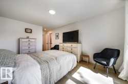 Bedroom featuring recessed lighting, light wood-finish flooring, and white walls - 