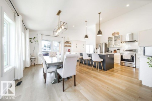 Vaulted ceilings highlight this open-concept kitchen and dining area - 11303 111 Avenue, Edmonton, AB - Indoor Photo Showing Other Room