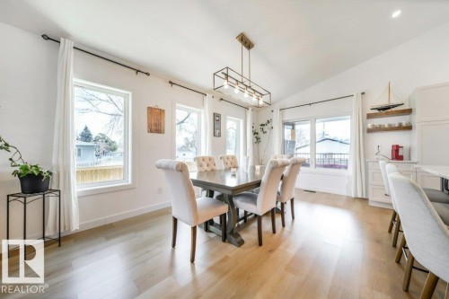 Dining area featuring a vaulted ceiling and light wood-finish flooring - 11303 111 Avenue, Edmonton, AB - Indoor Photo Showing Dining Room
