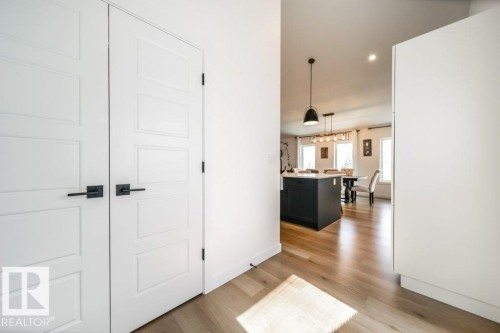 Bright foyer with light wood-finish flooring - 11303 111 Avenue, Edmonton, AB - Indoor Photo Showing Other Room