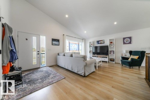 Bright open-concept living space with vaulted ceilings and recessed lighting - 11303 111 Avenue, Edmonton, AB - Indoor Photo Showing Living Room