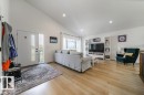 Bright open-concept living space with vaulted ceilings and recessed lighting - 11303 111 Avenue, Edmonton, AB  - Indoor Photo Showing Living Room 
