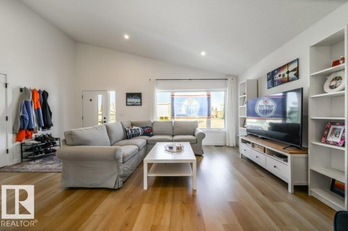 Living area featuring a vaulted ceiling with recessed lighting - 11303 111 Avenue, Edmonton, AB - Indoor Photo Showing Living Room