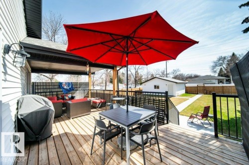 Spacious wood deck with black railing system - 11303 111 Avenue, Edmonton, AB - Outdoor With Deck Patio Veranda With Exterior