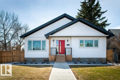 Crisp white siding exterior with a contrasting black roofline - 11303 111 Avenue, Edmonton, AB - Outdoor