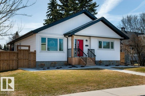 Classic-style residence with white vertical siding and dark trim - 11303 111 Avenue, Edmonton, AB - Outdoor