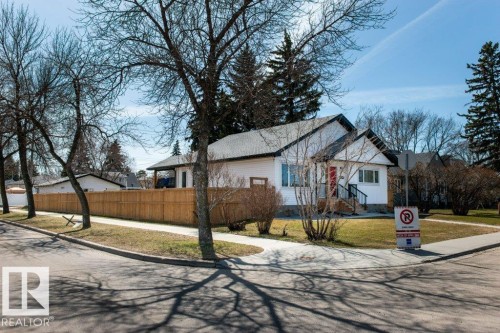 White exterior residence with a contrasting dark roofline - 11303 111 Avenue, Edmonton, AB - Outdoor