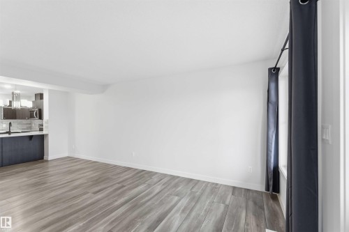 Open concept living area with wood-finish flooring - 36 1005 Graydon Hill Boulevard, Edmonton, AB 