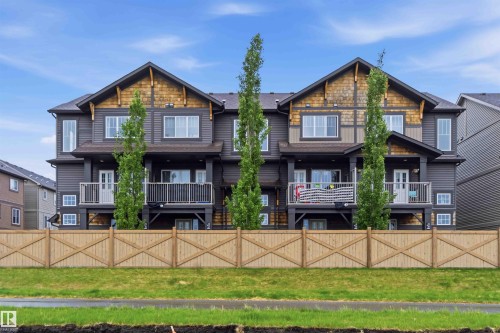 Modern townhome exterior featuring multi-toned siding and cedar shake accents - 36 1005 Graydon Hill Boulevard, Edmonton, AB 