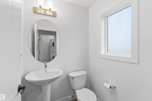 Pedestal sink with chrome faucet and oval mirror - 36 1005 Graydon Hill Boulevard, Edmonton, AB 