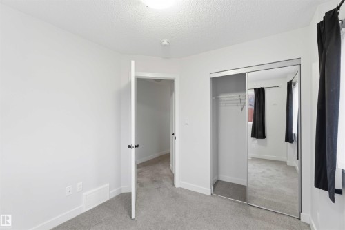 Bedroom featuring light gray carpet flooring and white painted walls - 36 1005 Graydon Hill Boulevard, Edmonton, AB 