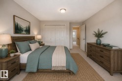Bedroom featuring light-toned wall paint and neutral carpeting - 